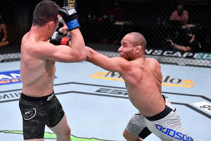 Intense Fight Moment: Merab Dvalishvili In Action Background