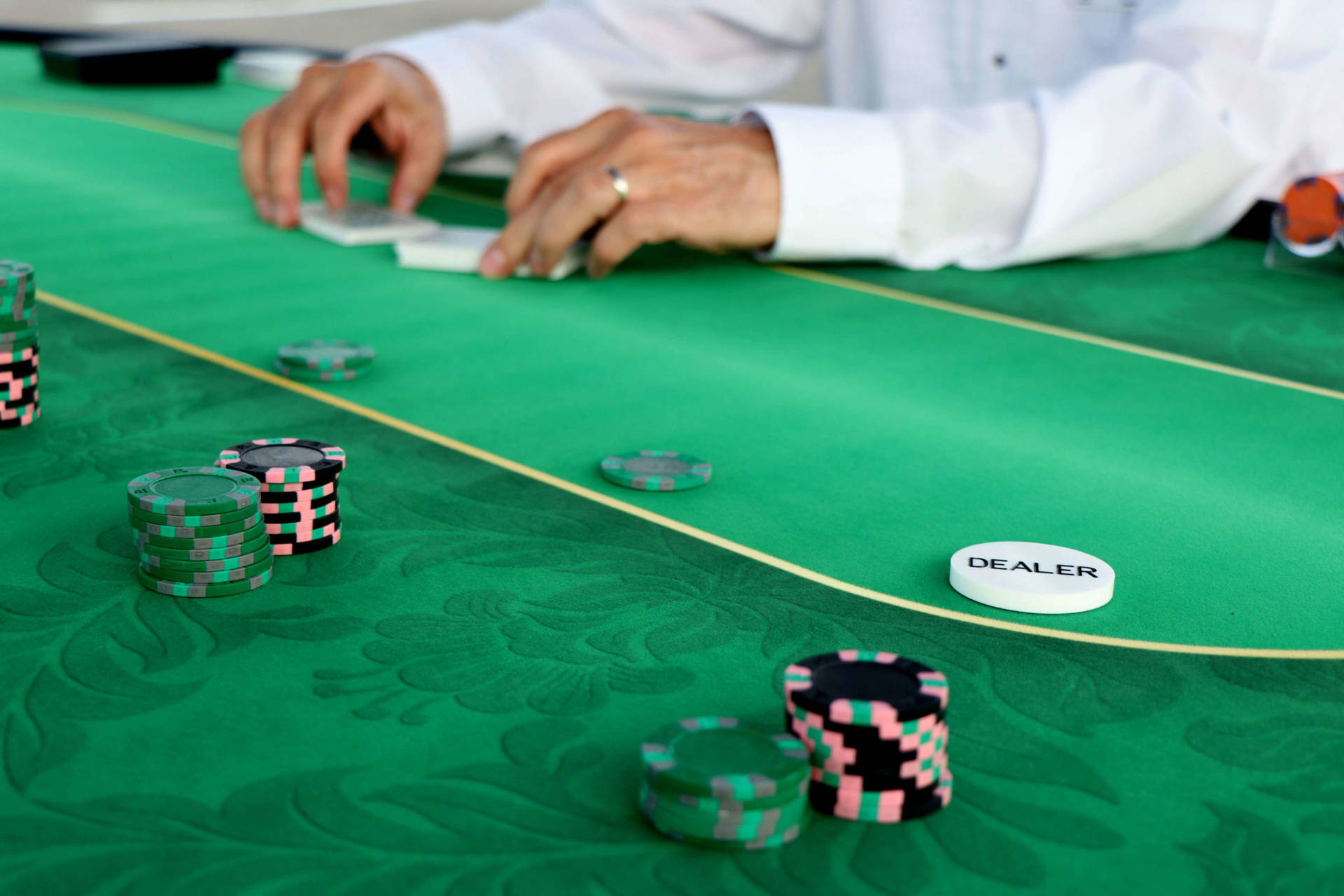 Intense Game Of Texas Hold'em On A Green Felt Table Background