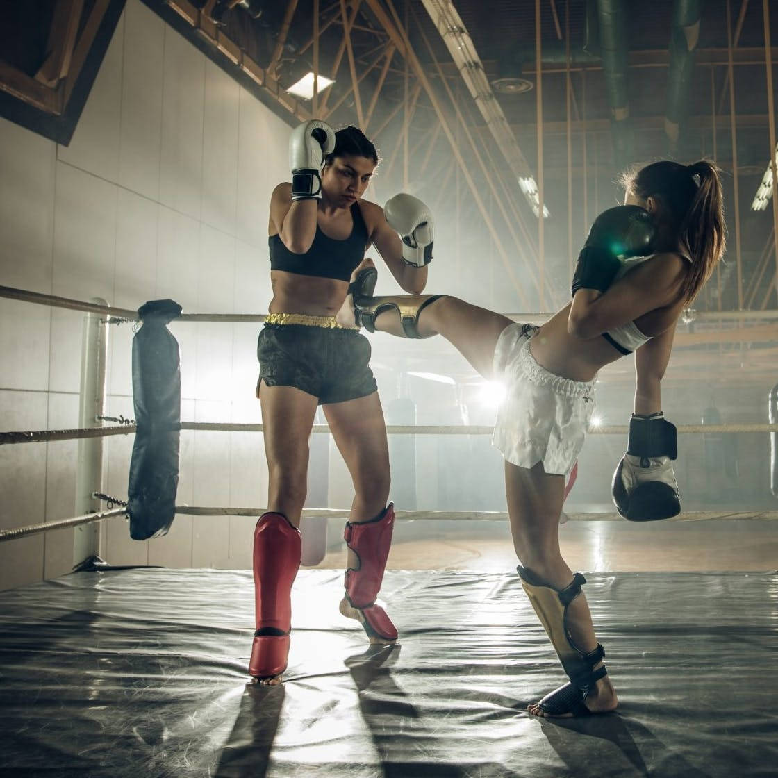 Intense Kickboxing Sparring Session Among Two Female Athletes.