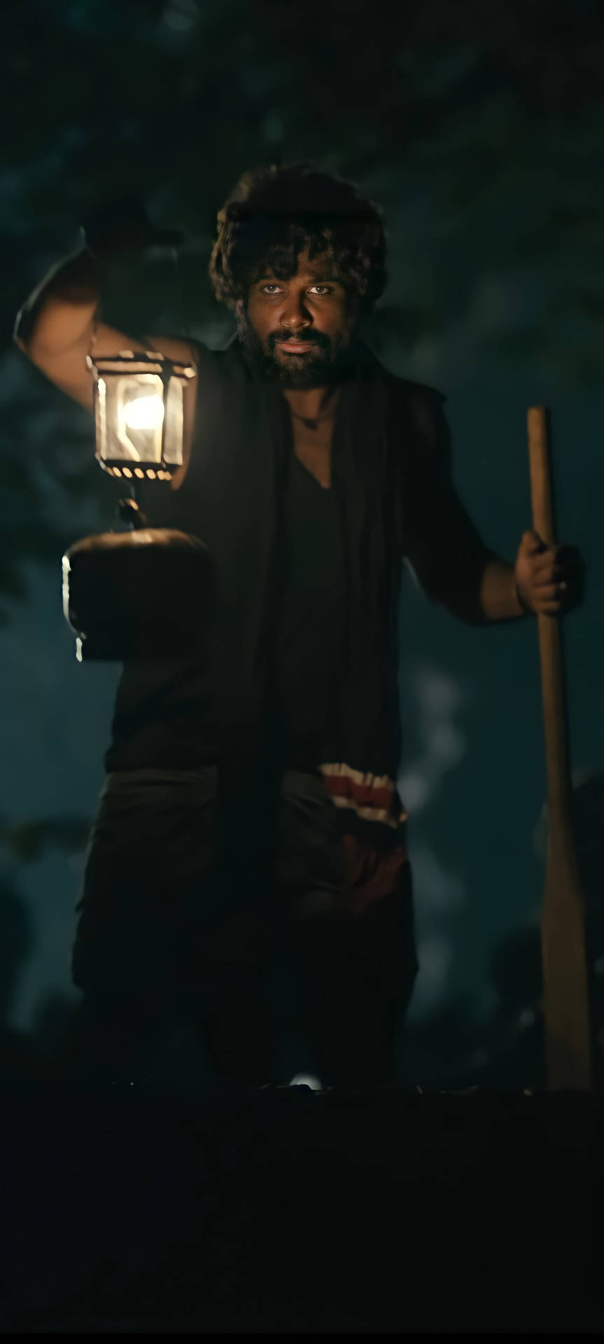 Intense Look Of Allu Arjun As Pushpa Raj Under A Lamp Light Background