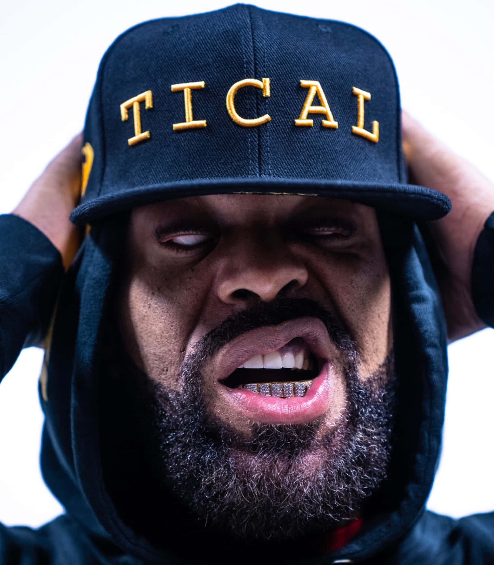 Intense Manwith Tical Cap Background