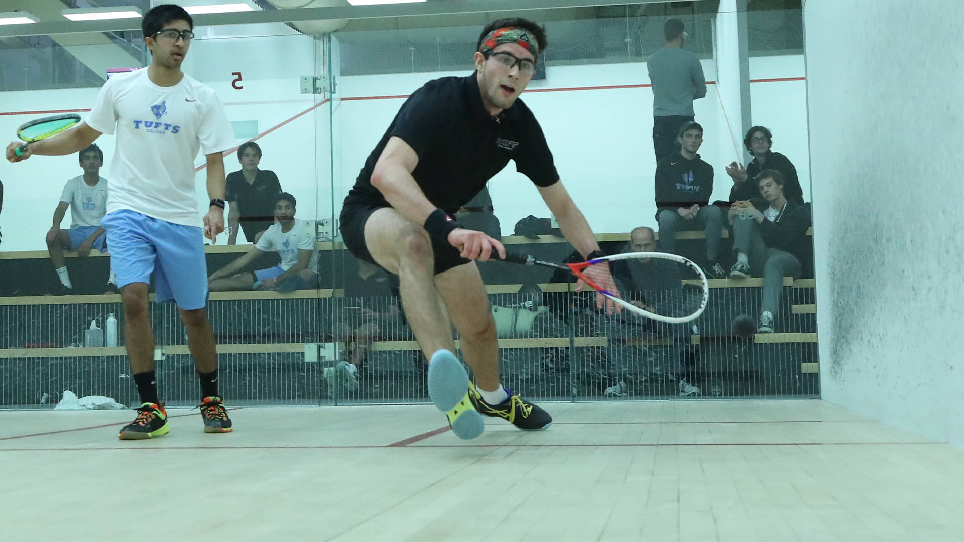 Intense Moment At Men's Squash Competition Background