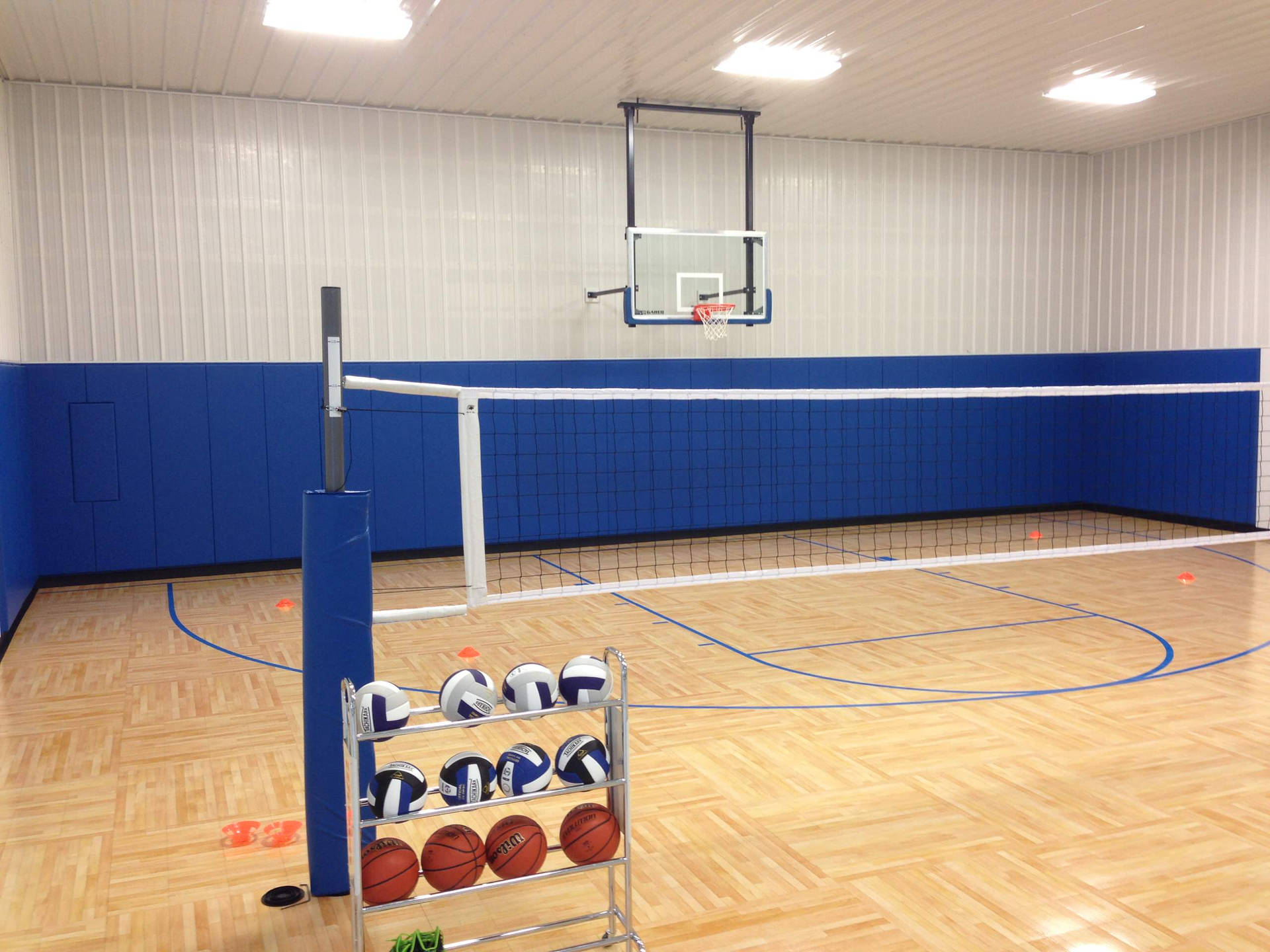 Intense Showdown Between Indoor Volleyball Teams Background