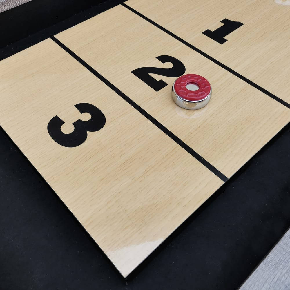 Intense Shuffleboard Game On Polished Wood Background