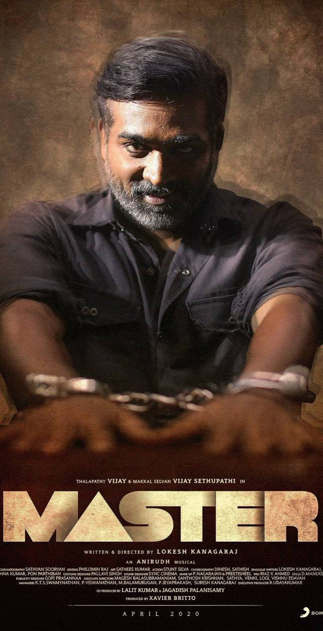 Intense Still Of Vijay Sethupathi Handcuffed On A Table From The Movie Master In Hd