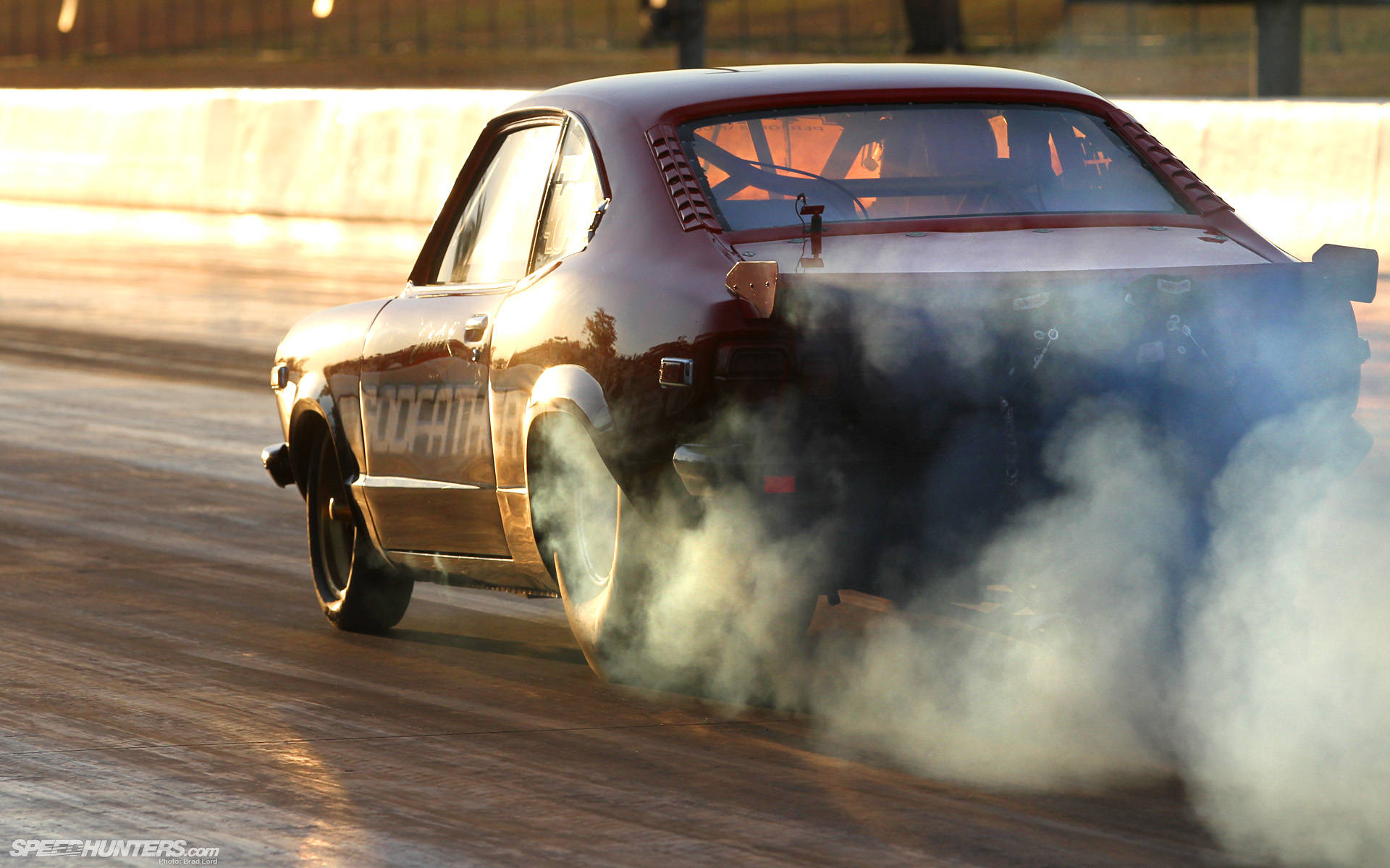 Intense Thrill With Mazda Rx-3 Drag Racing Background