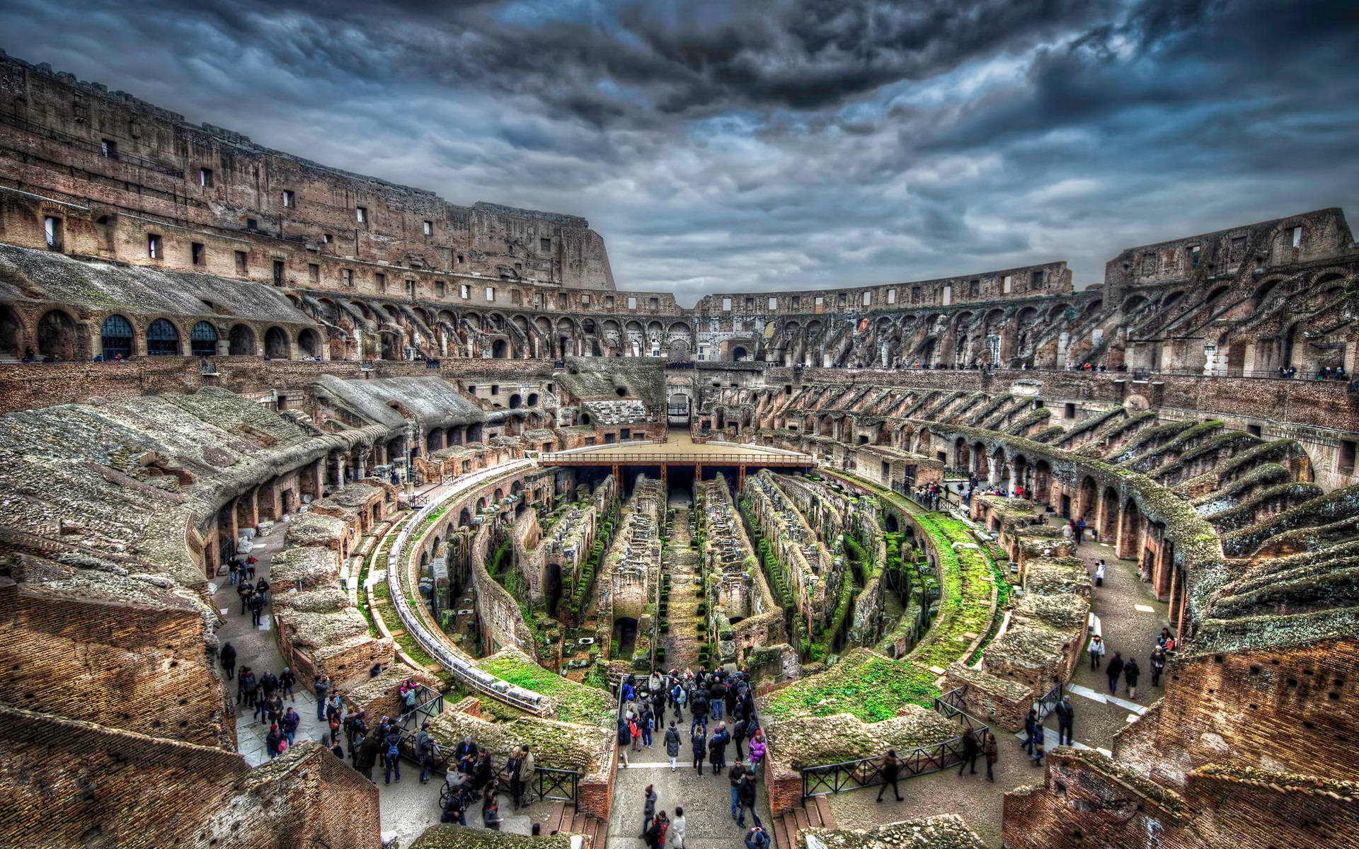 Interior Of The Colosseum Beneath A Dark Sky