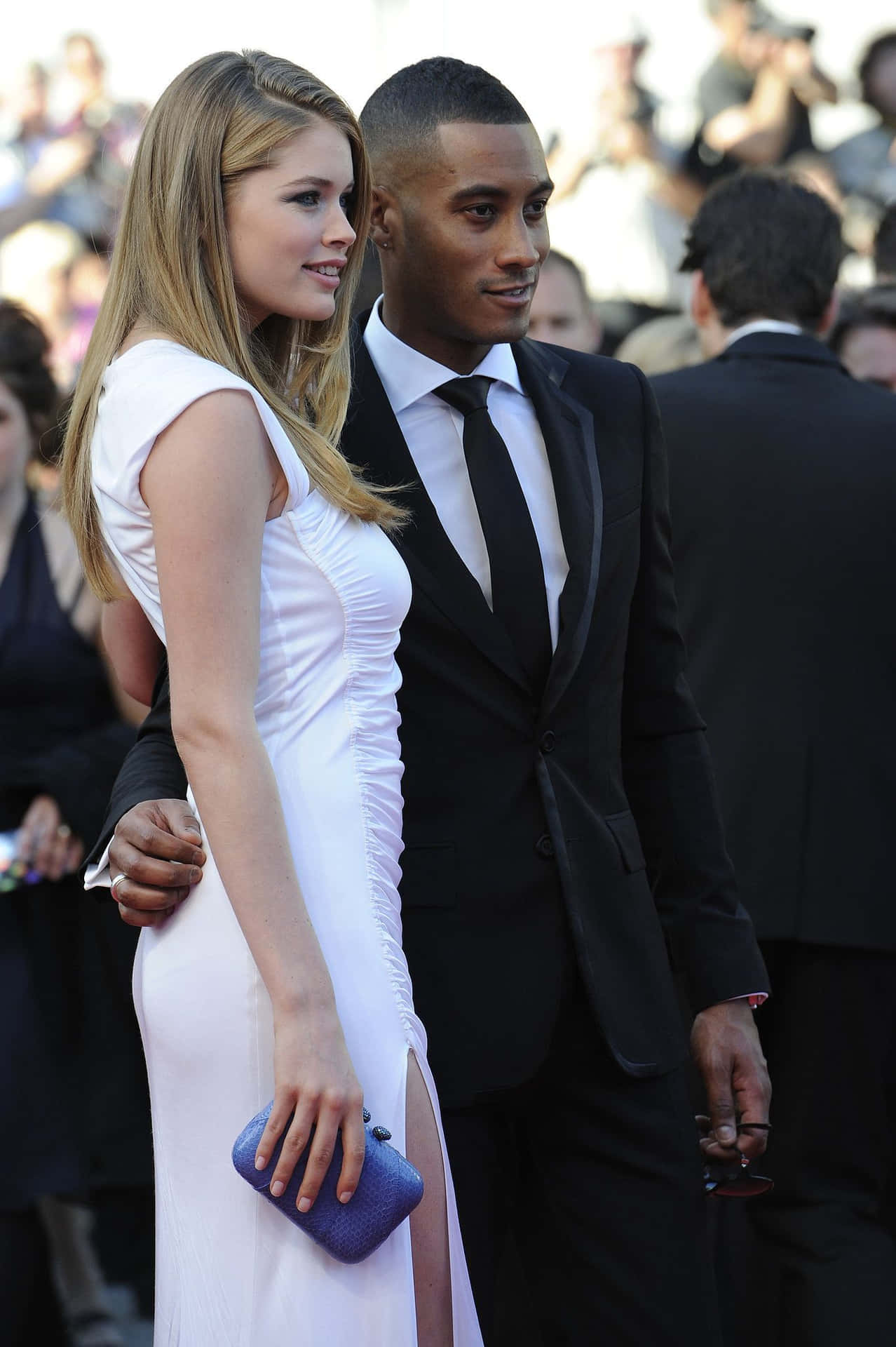 Interracial Couple In Red Carpet Background