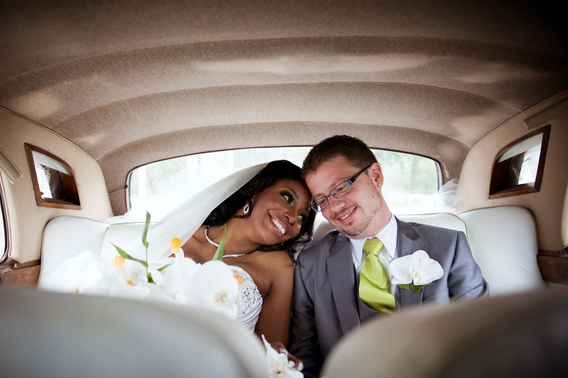 Interracial Couple In Wedding Car