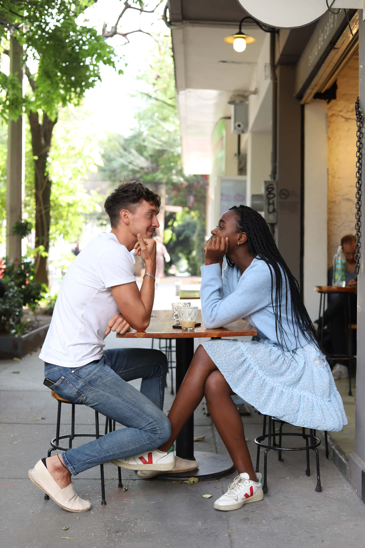 Interracial Couple On Cafe Date Background