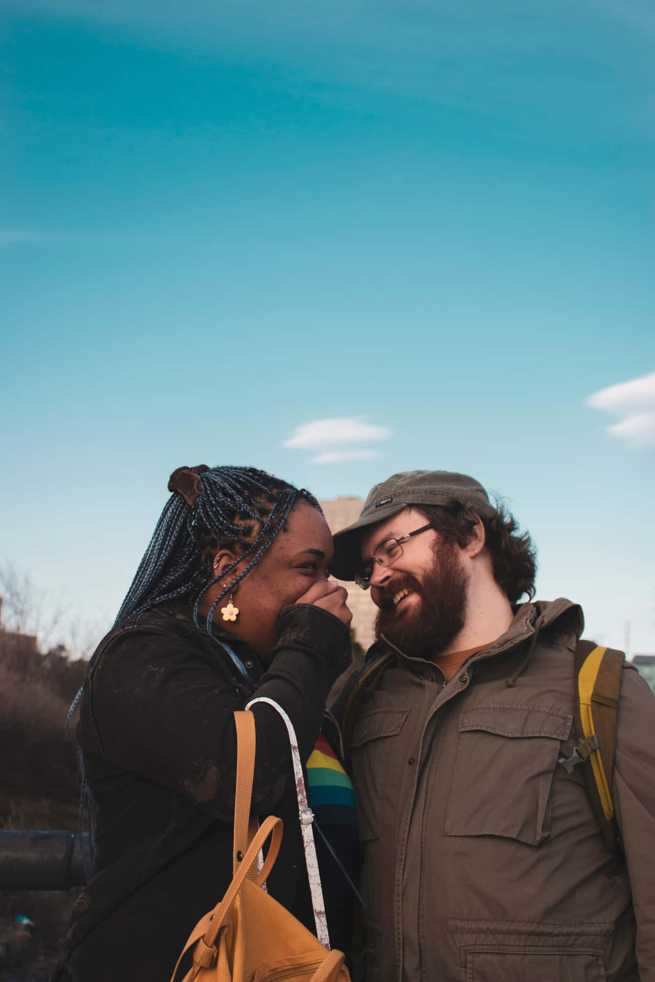 Interracial Couple Smiling Blue Skies Background