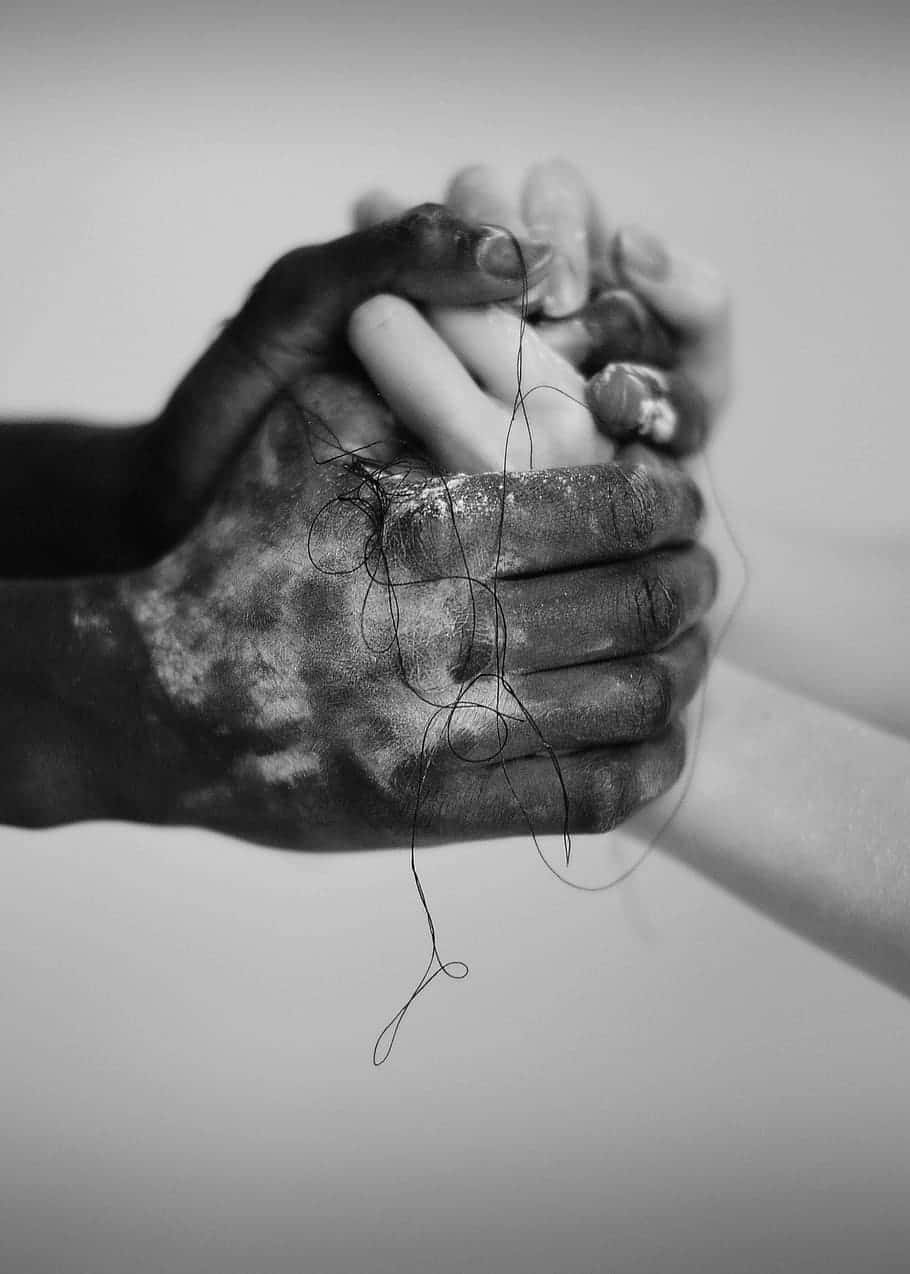 Interracial Monochrome Holding Hands Background