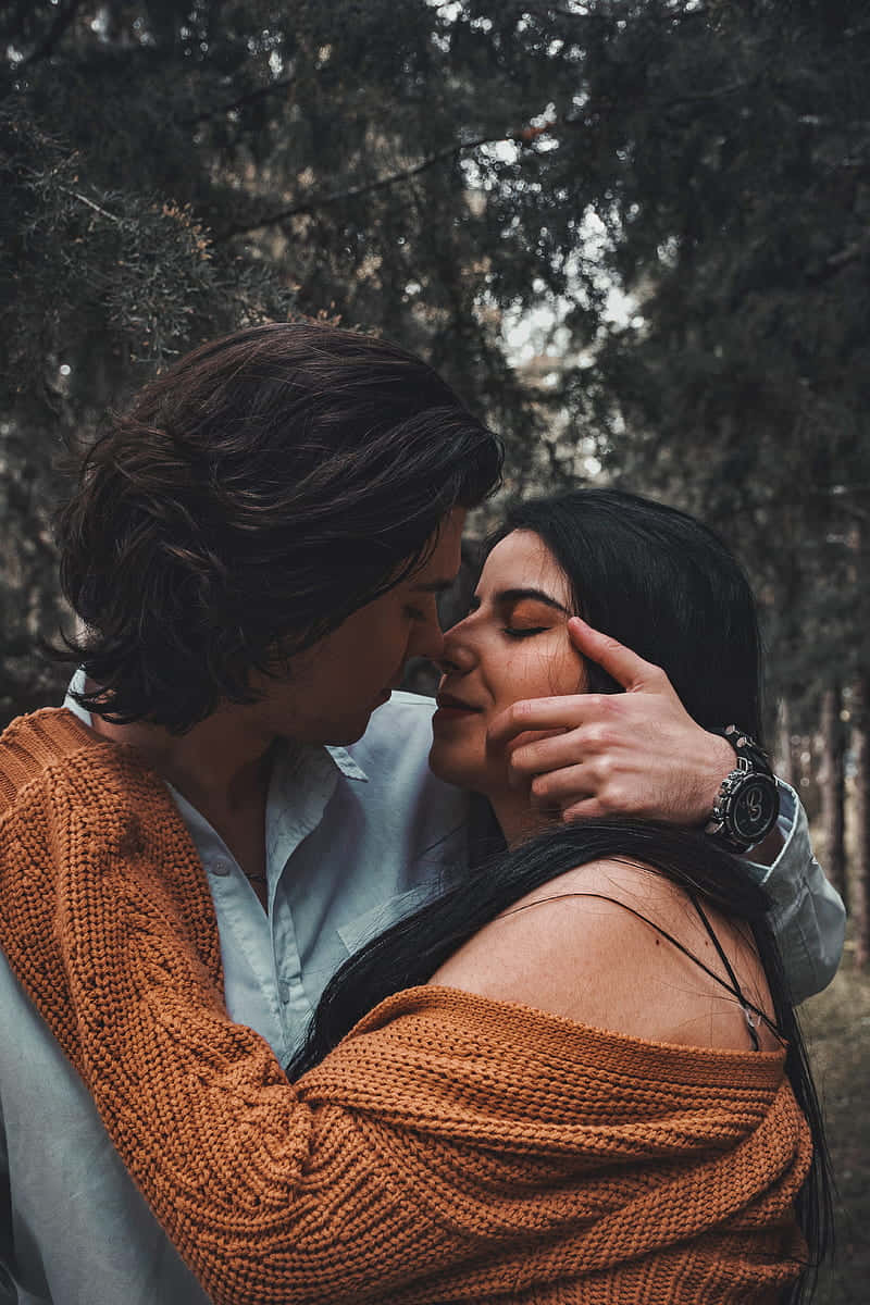 Intimate Couple Forest Embrace Background