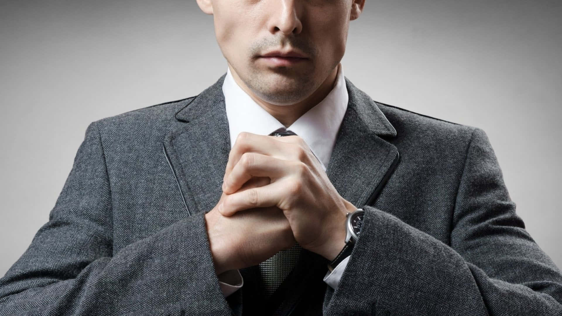 Intimidating Man In Suit Background