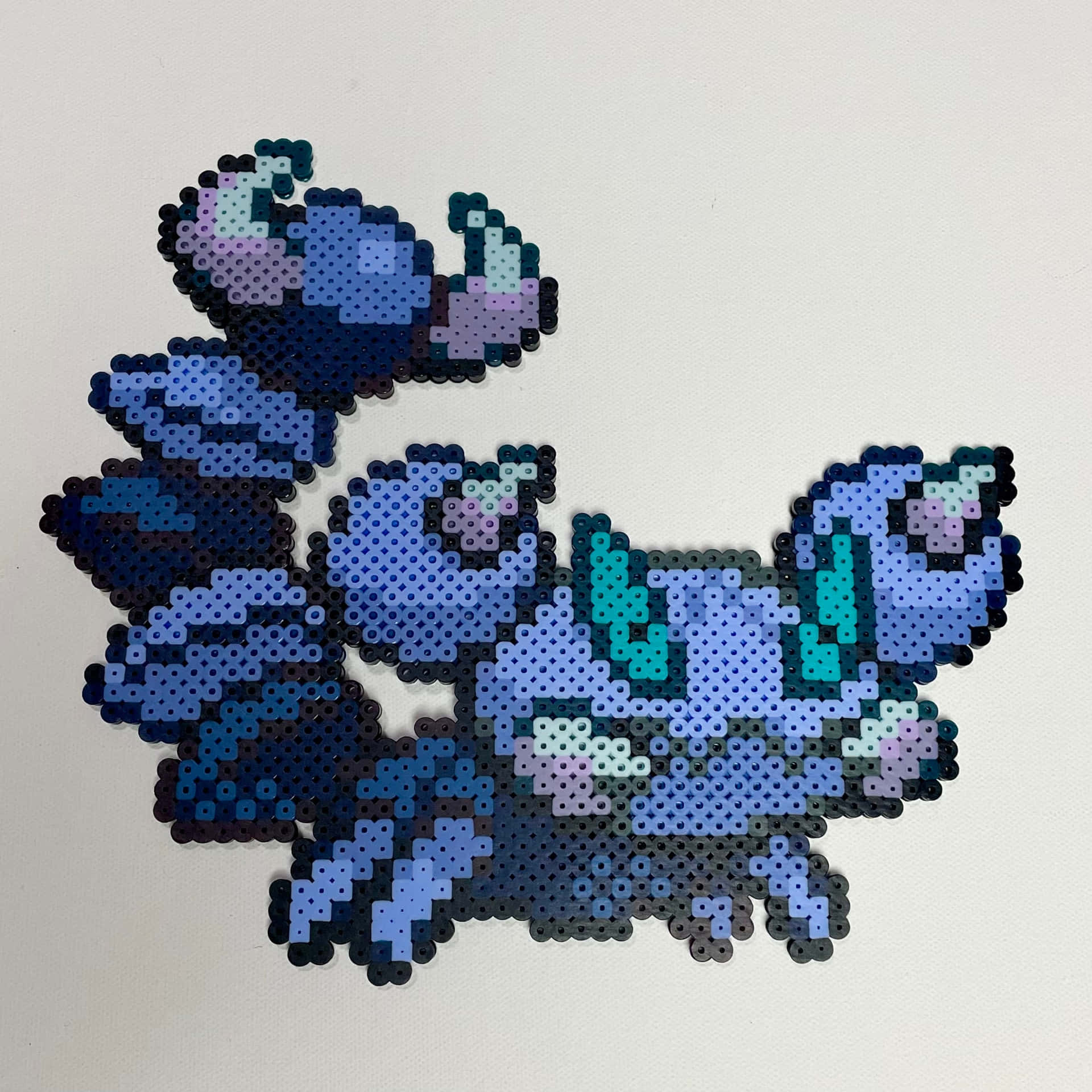 Intricate Bead Craft Depiction Of Skorupi, A Toxic Scorpion Pokémon Background