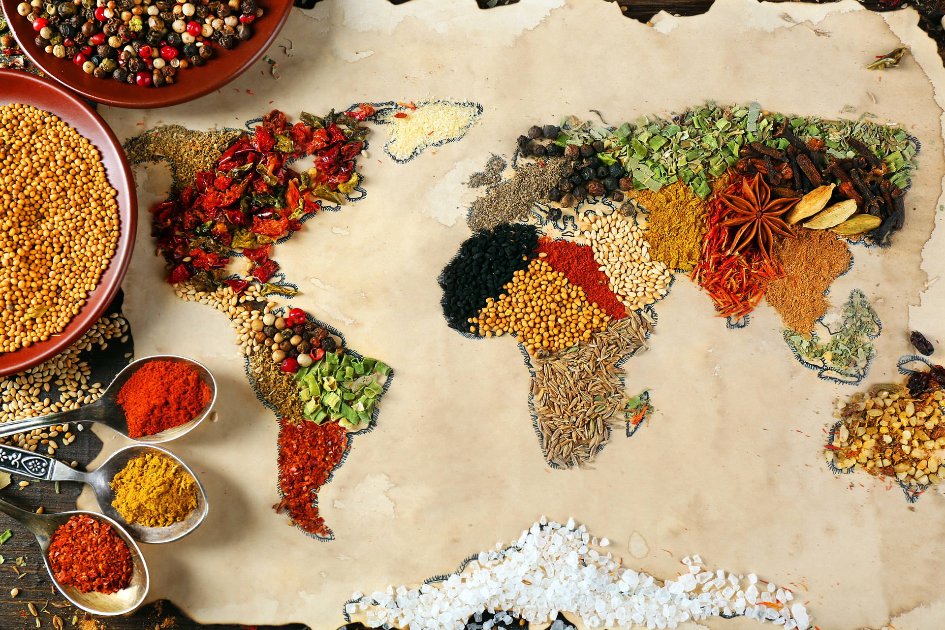 Intricate World Map Formed By Vibrant Grains Background