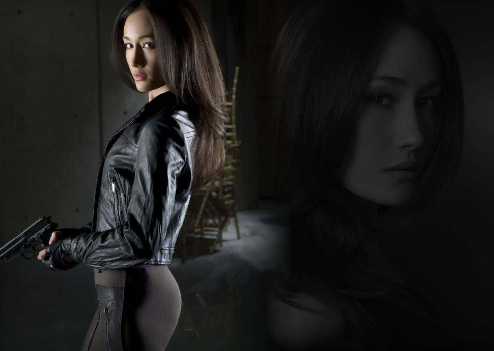 Intriguing Maggie Q Posing For A Photoshoot Background