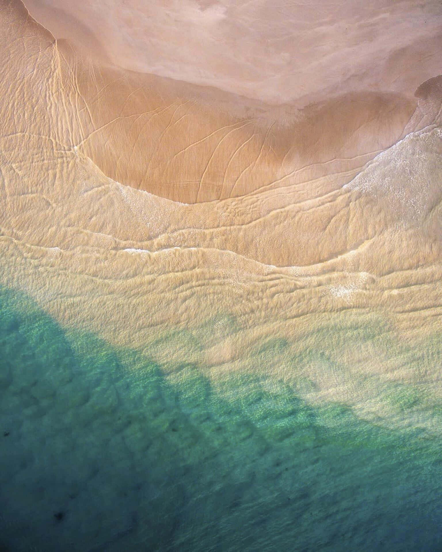 Ios Beach - A Paradise Of Turquoise Waters And White Sandy Beaches Background