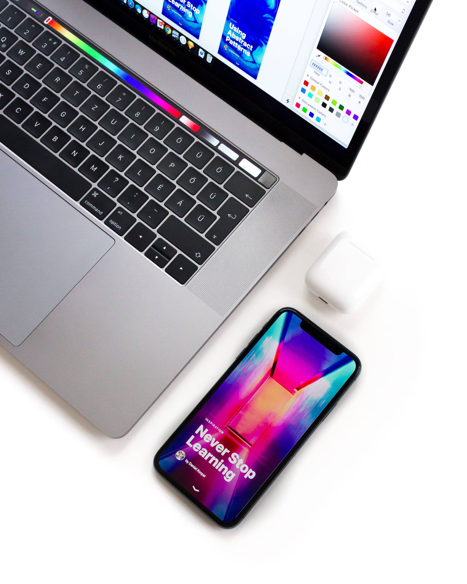 Iphone Desk With Colorful Phone Screen Background