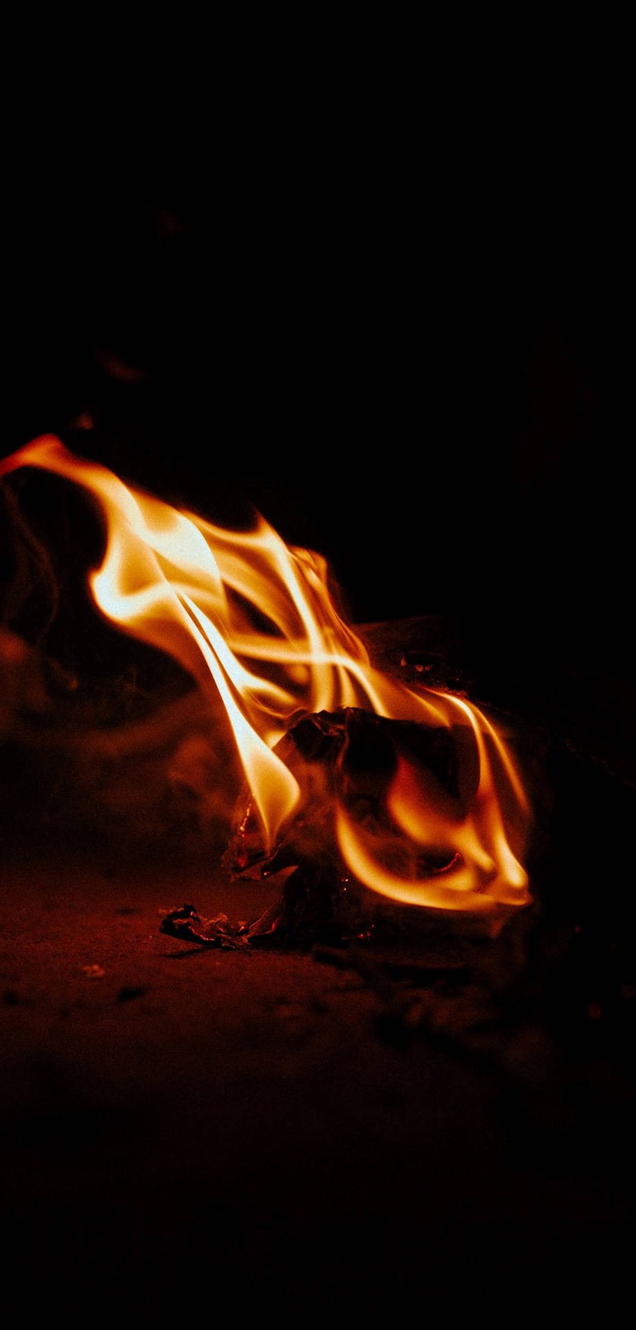 Iphone Fire In The Dark Background