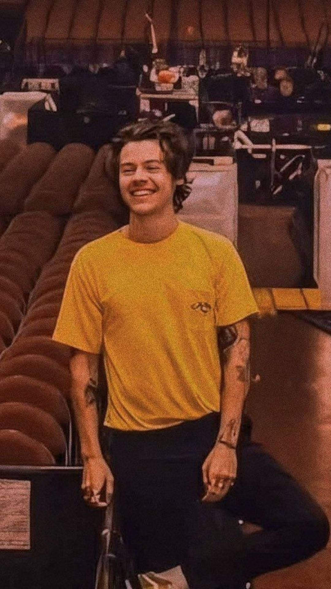 Iphone Harry Styles In A Yellow Shirt Background