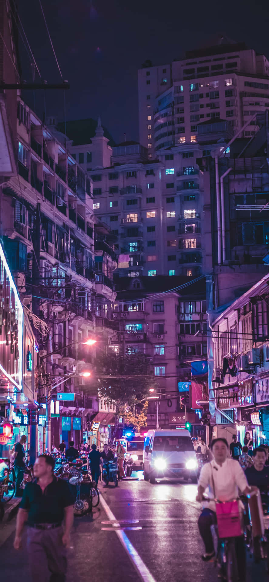 Iphone Xs Max Capturing A Bustling City Night Background