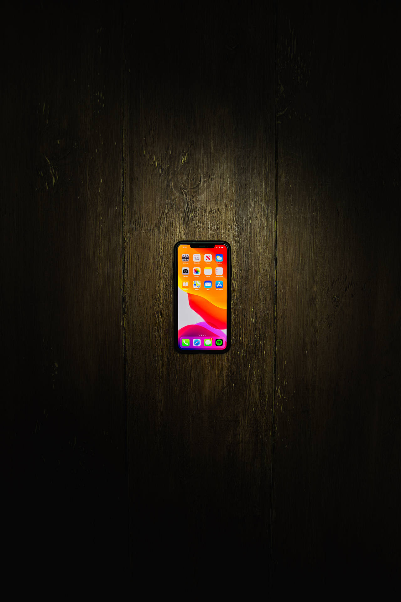 Iphone Xs Max On Wooden Floor Background