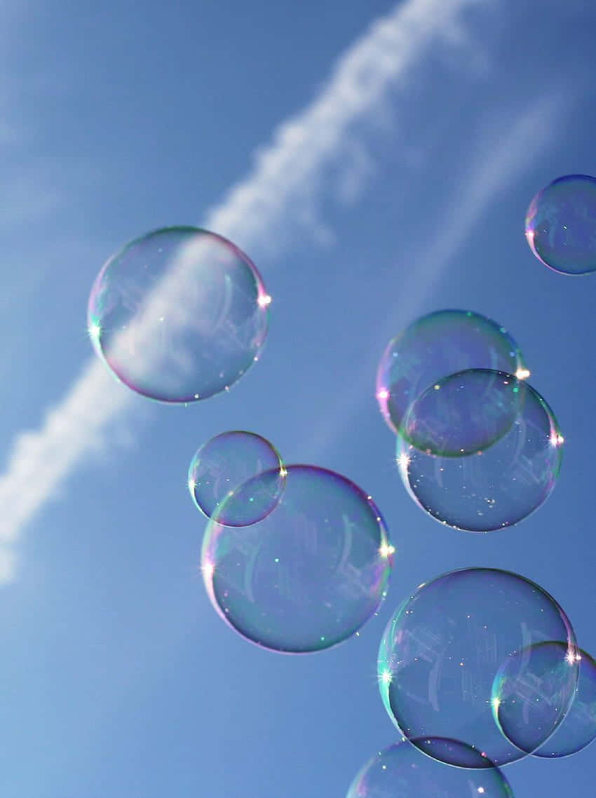 Iridescent Soap Bubbles Sky Background Background