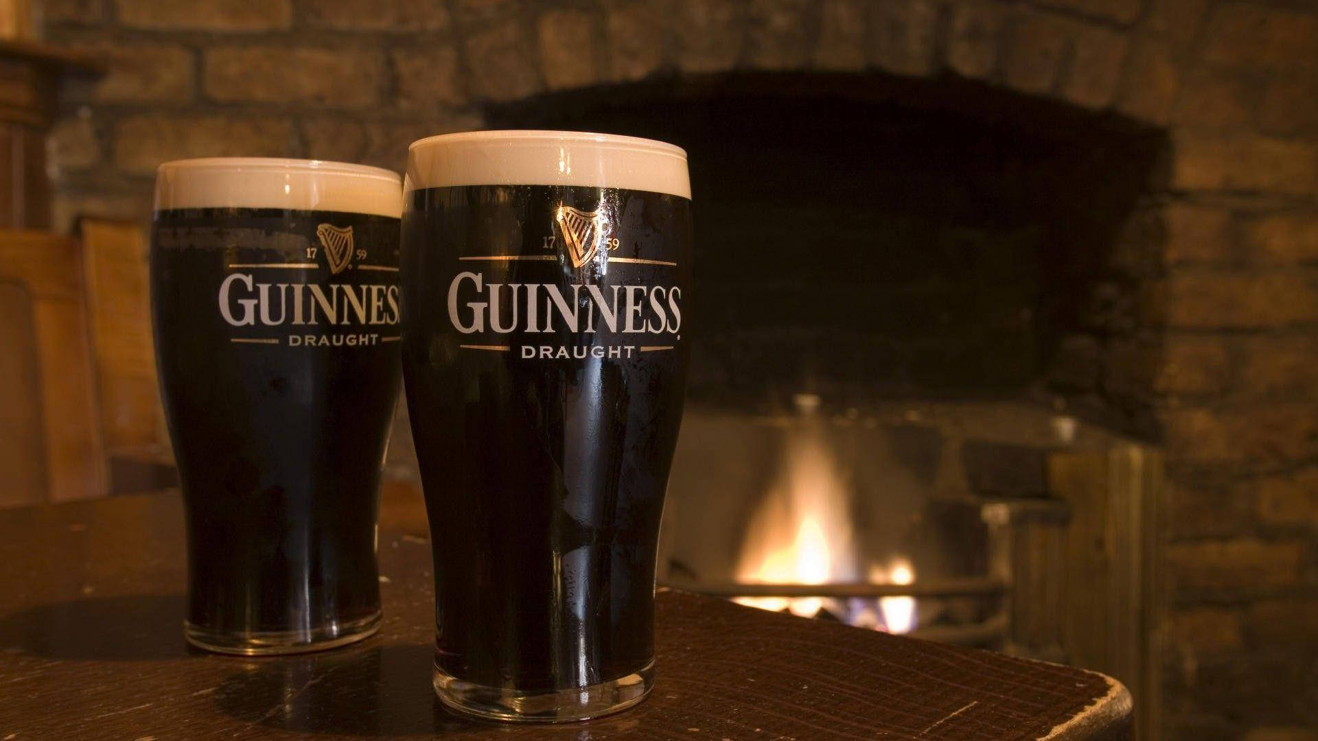 Irish Dry Stout Guinness Near Fireplace Background