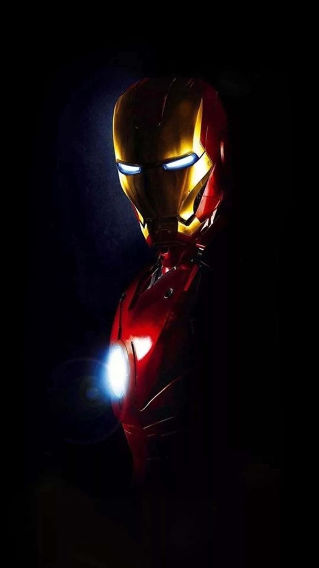 Iron Man In The Dark With His Helmet On Background