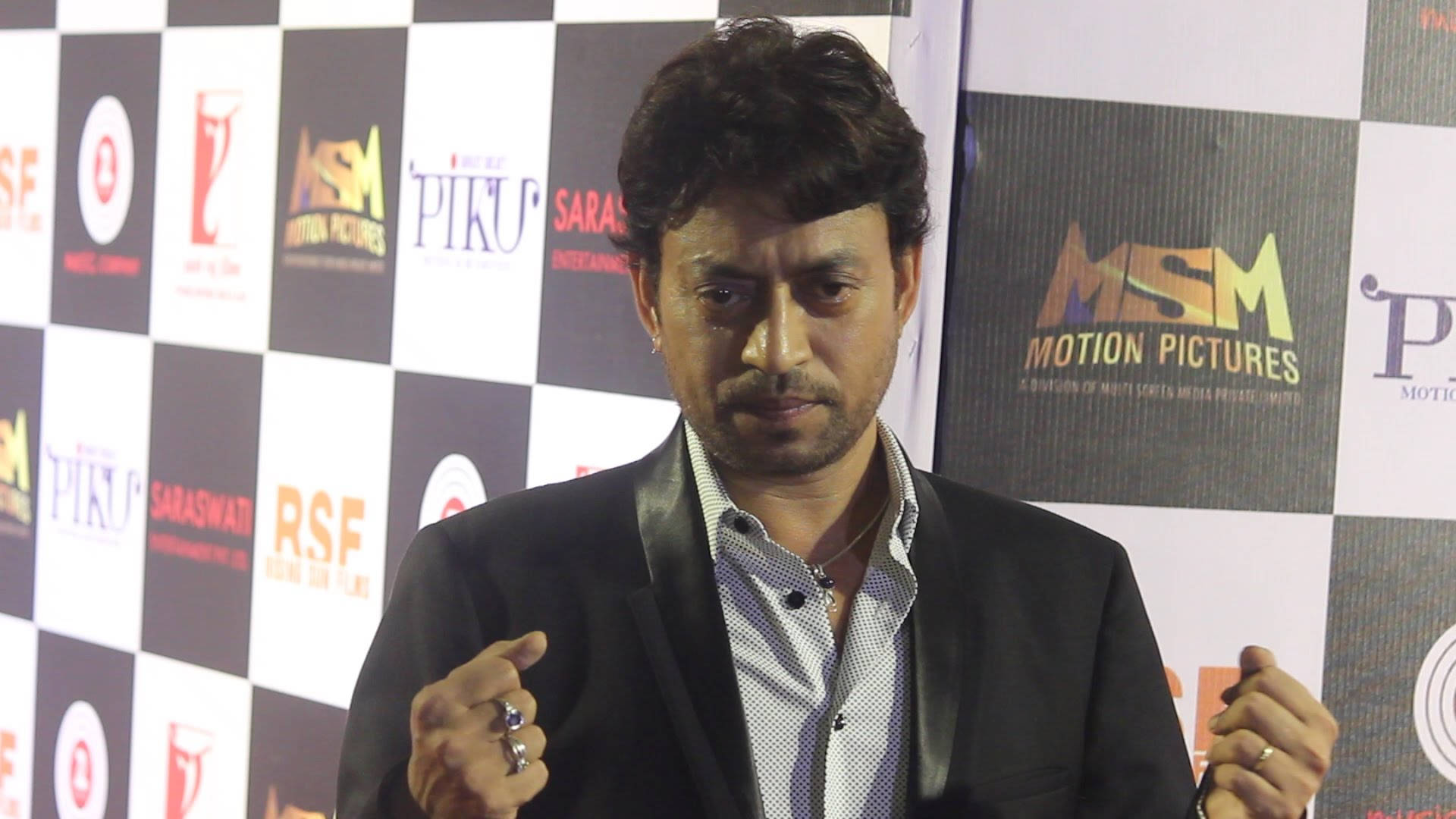 Irrfan Khan Closed Fists Background