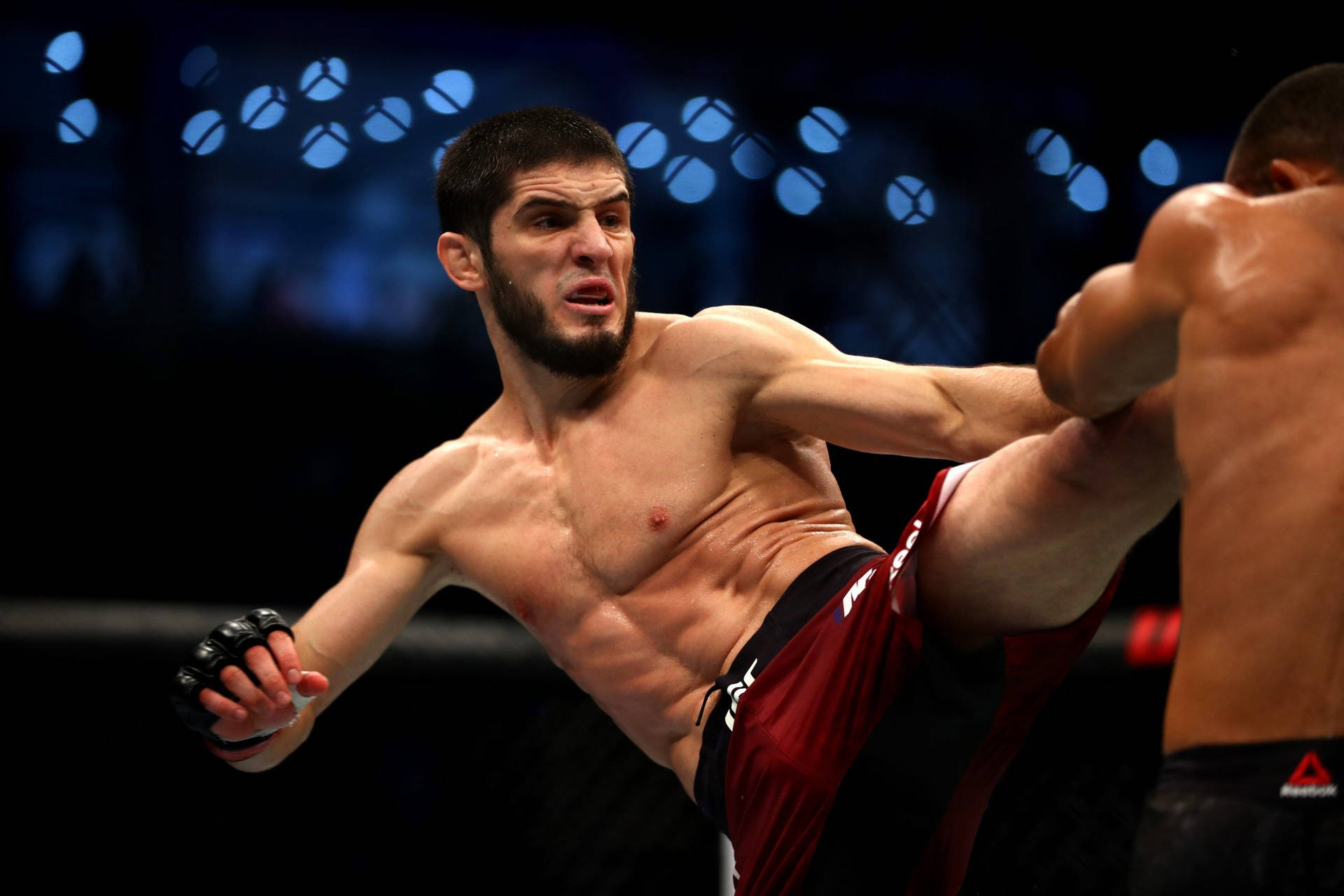 Islam Makhachev In Action Background