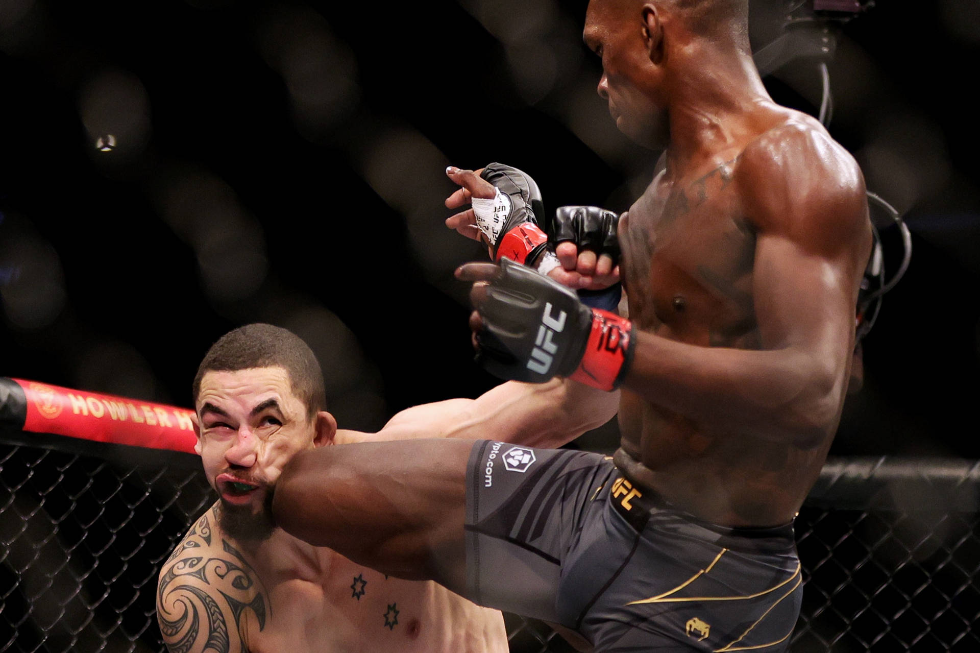 Israel Adesanya Knee On Robert Whittaker Face Background