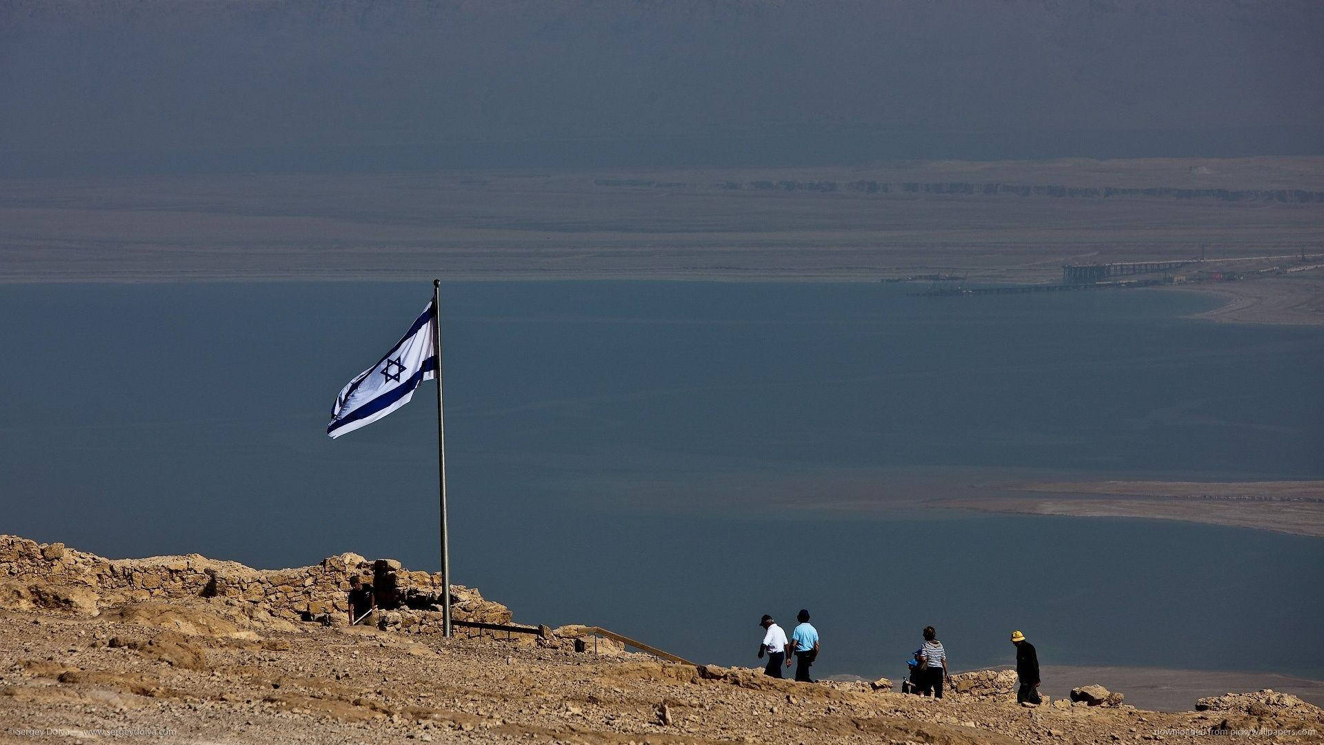 Israel Flag Fluttering By The Seaside
