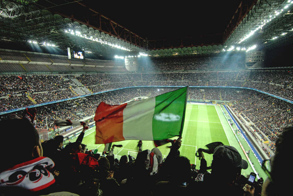 Italian Football Match At Stadium With Flag Background