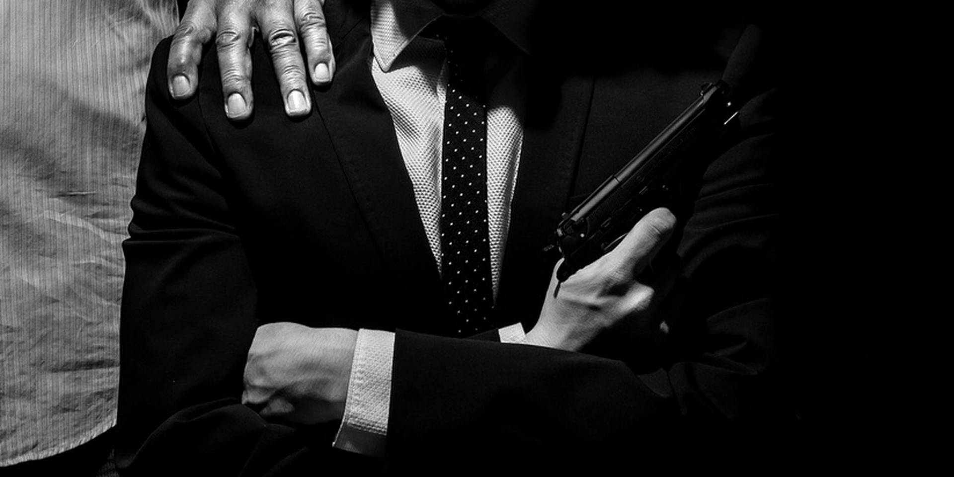 Italian Mafia Holding A Gun Background