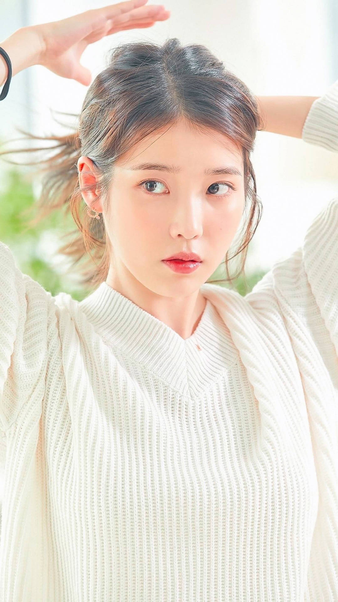 Iu Fixing Hair In White Background