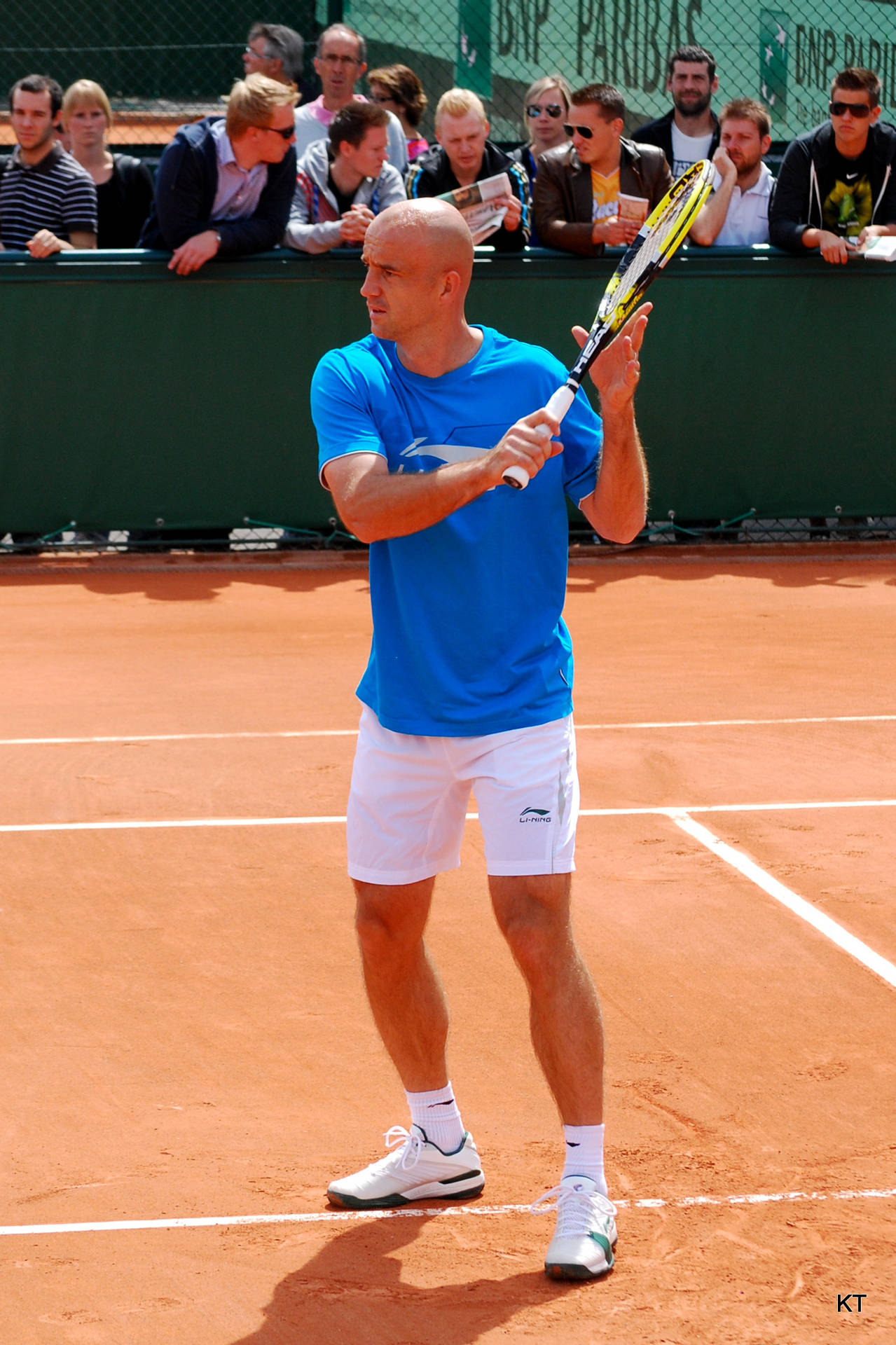 Ivan Ljubicic Powerfully Striking A Shot On A Clay Court Background