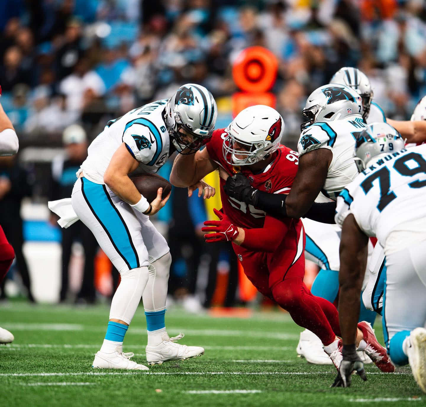 J.j. Watt Standing In A Football Arena Background
