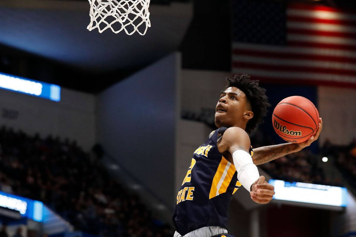 Ja Morant Executing A Powerful One-handed Dunk Background