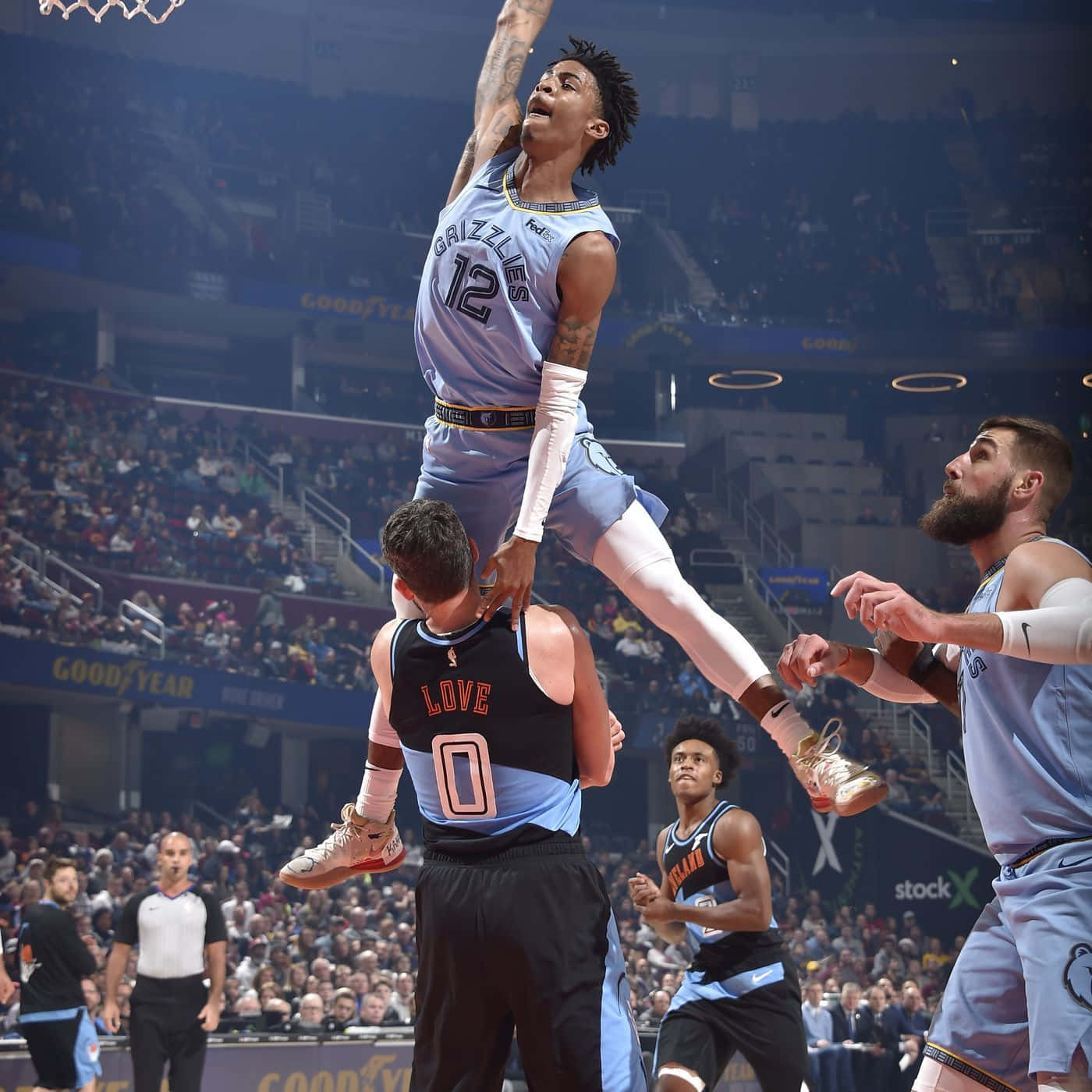 Ja Morant Shows Off His Thrilling Athleticism As He Drives To The Hoop Background