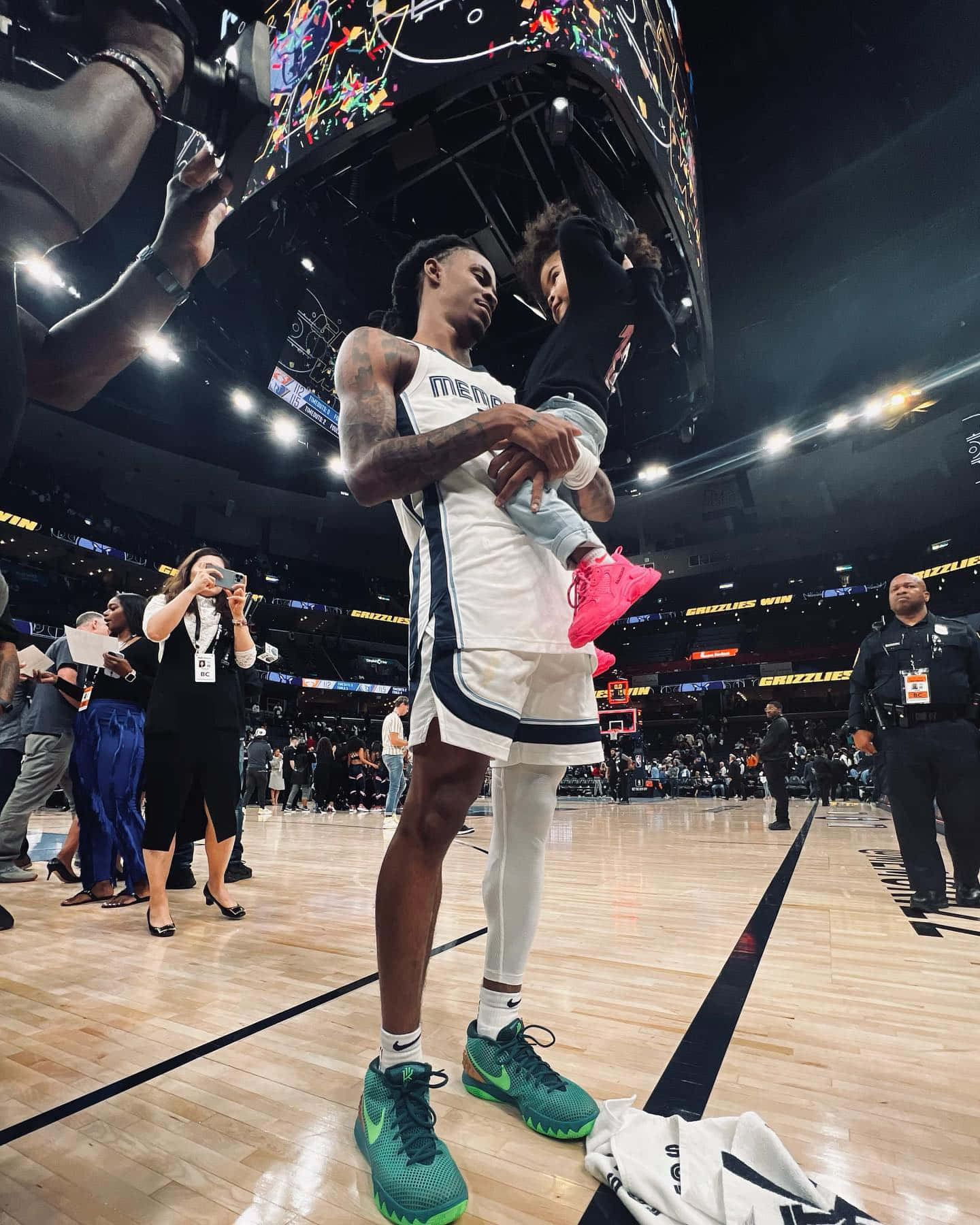 Ja Morrant Holding His Child Background