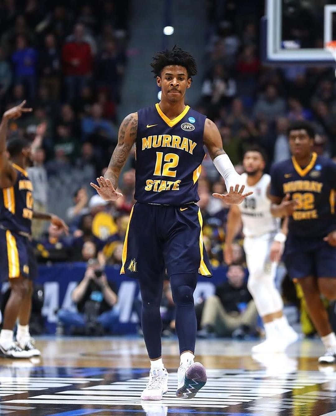 Ja Morrant In Dark Blue Jersey Background