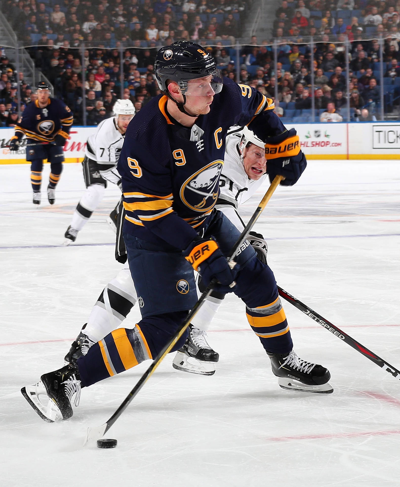 Jack Eichel Black Buffalo Uniform Attacking Background