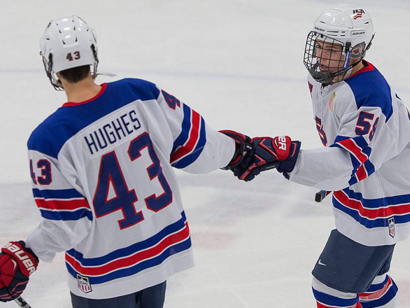 Jack Hughes Jubilantly Celebrates With His Teammates. Background