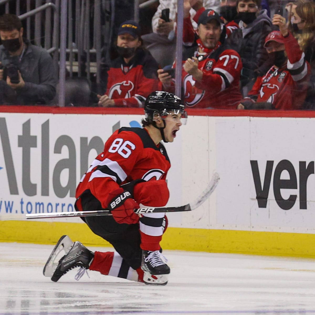 Jack Hughes Shouting And Kneeling Background