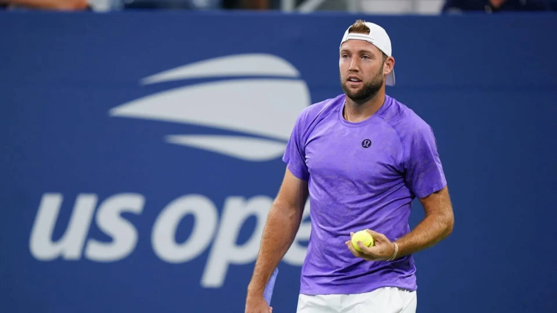 Jack Sock Holding A Tennis Ball Background