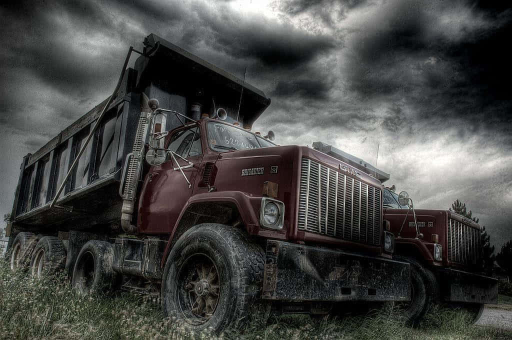 Jacked Up Trucks On Cloudy Day Background