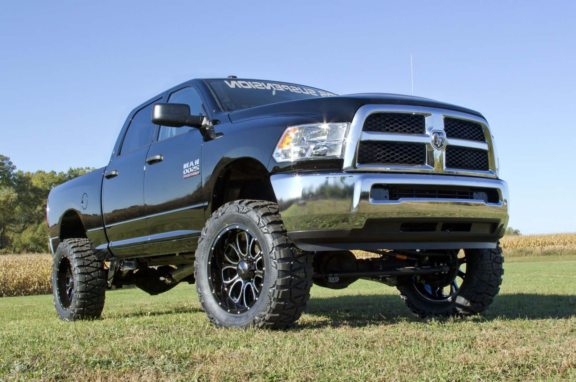 Jacked Up Trucks With Black Rims Background