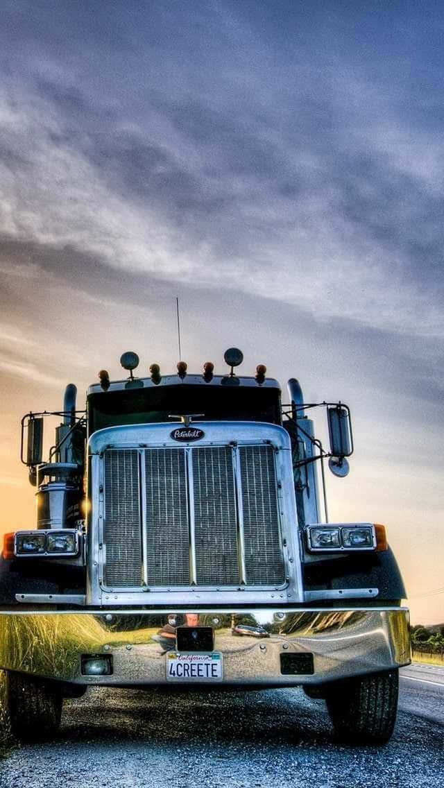 Jacked Up Trucks With Glossy Hood Covers Background